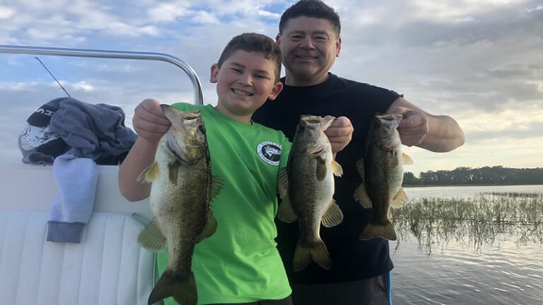 Family fishing on Lake Toho in Kissimmee, Florida