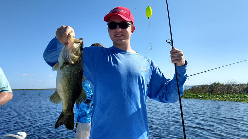 Young angler holding a December Lake Okeechobee bass