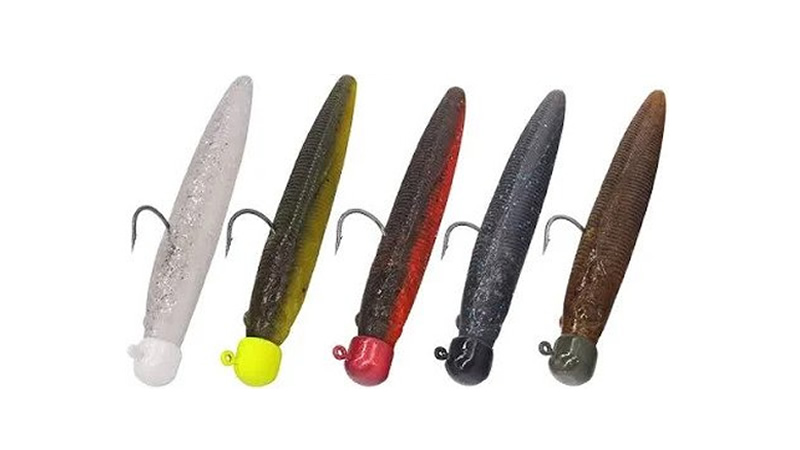 Six Ned rig soft-plastic baits on mushroom jigheads in natural and bright colors