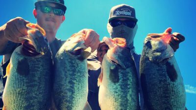 A group of anglers preparing for a bass fishing excursion.