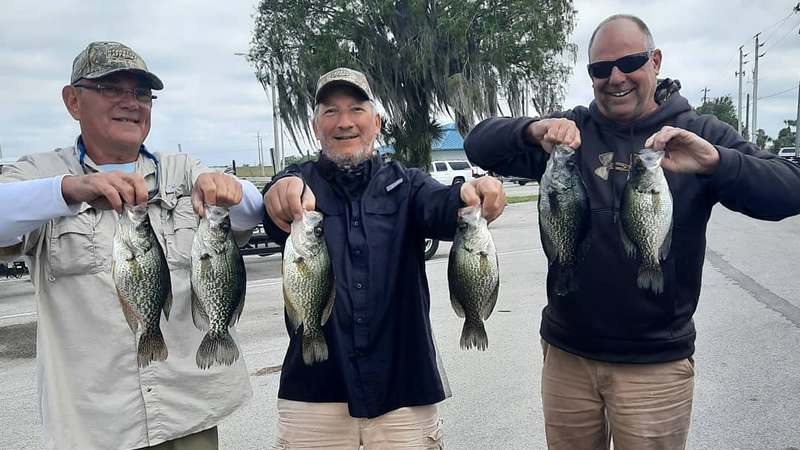Catch Your Limit: Lake Okeechobee Crappie Fishing Adventures 6 Freshwater fishing Angler catching Speckled Perch using live bait for crappie fishing