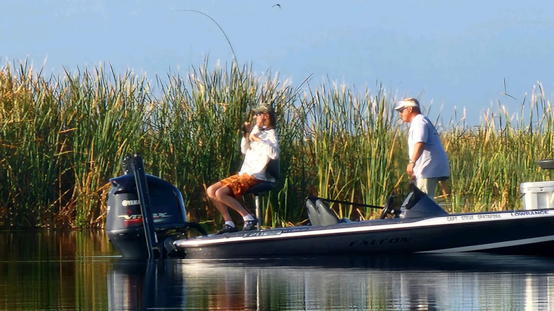 Angler casting a lure in the prime fishing location at Headwaters Lake