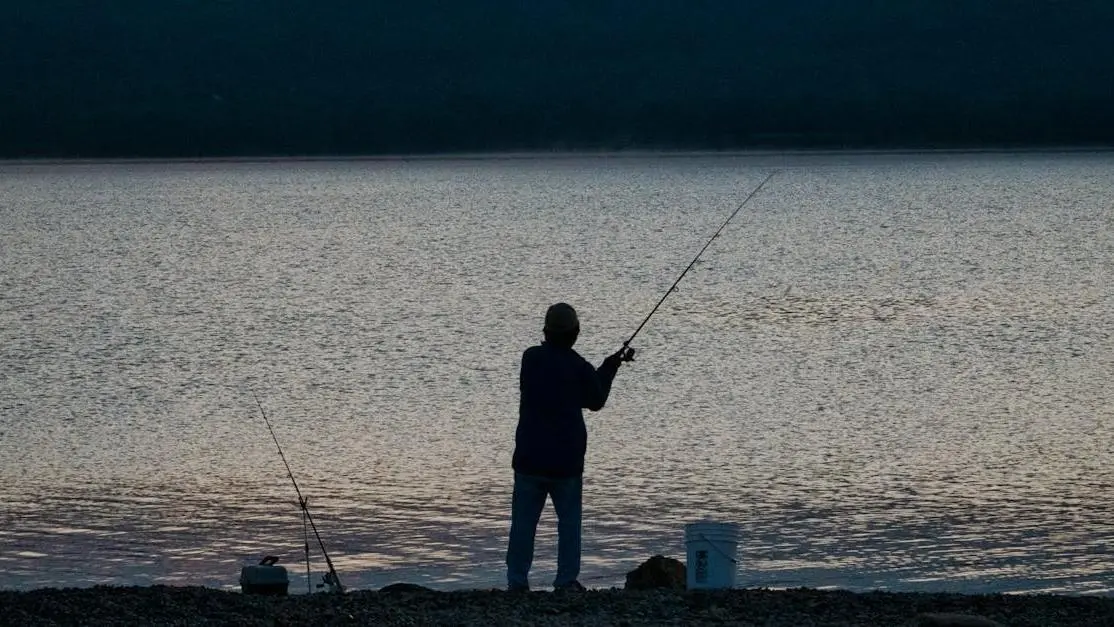 Angler night spinnerbait fishing on Lake Toho, Orlando, FL.